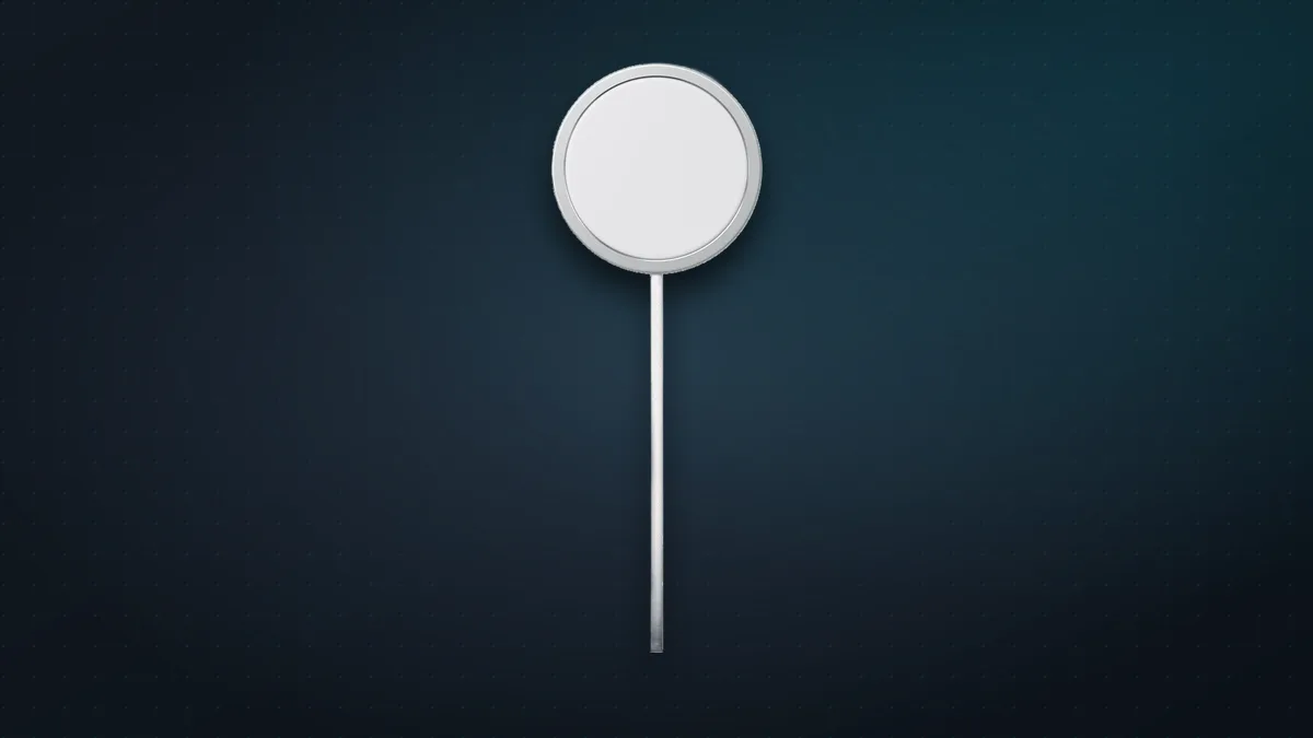 Apple MagSafe Charger, a white magnetic charging puck with a long cable