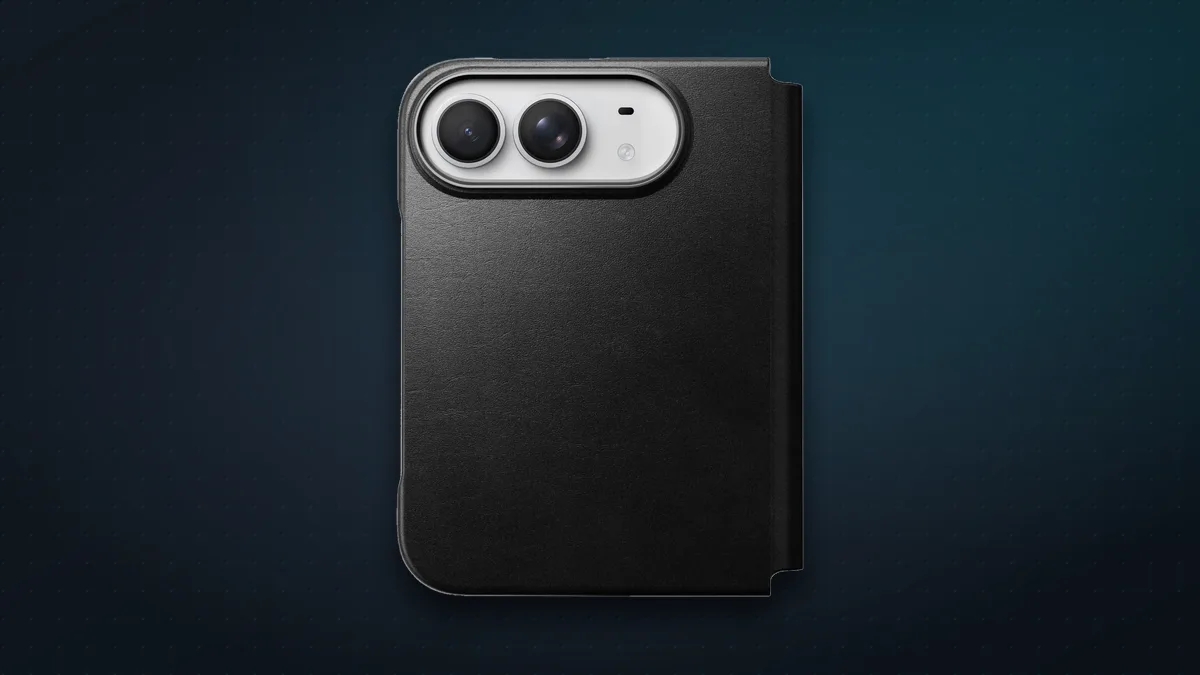 Nomad Traditional Leather Folio in black Horween leather, closed around an iPhone Duo