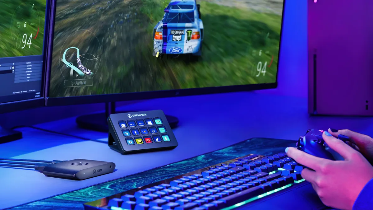 Stream Deck MK.2 on a gaming desk next to a keyboard and controller